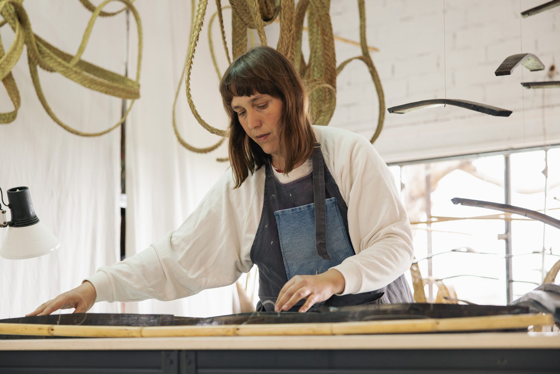 Aloma Lafontana working at the studio table