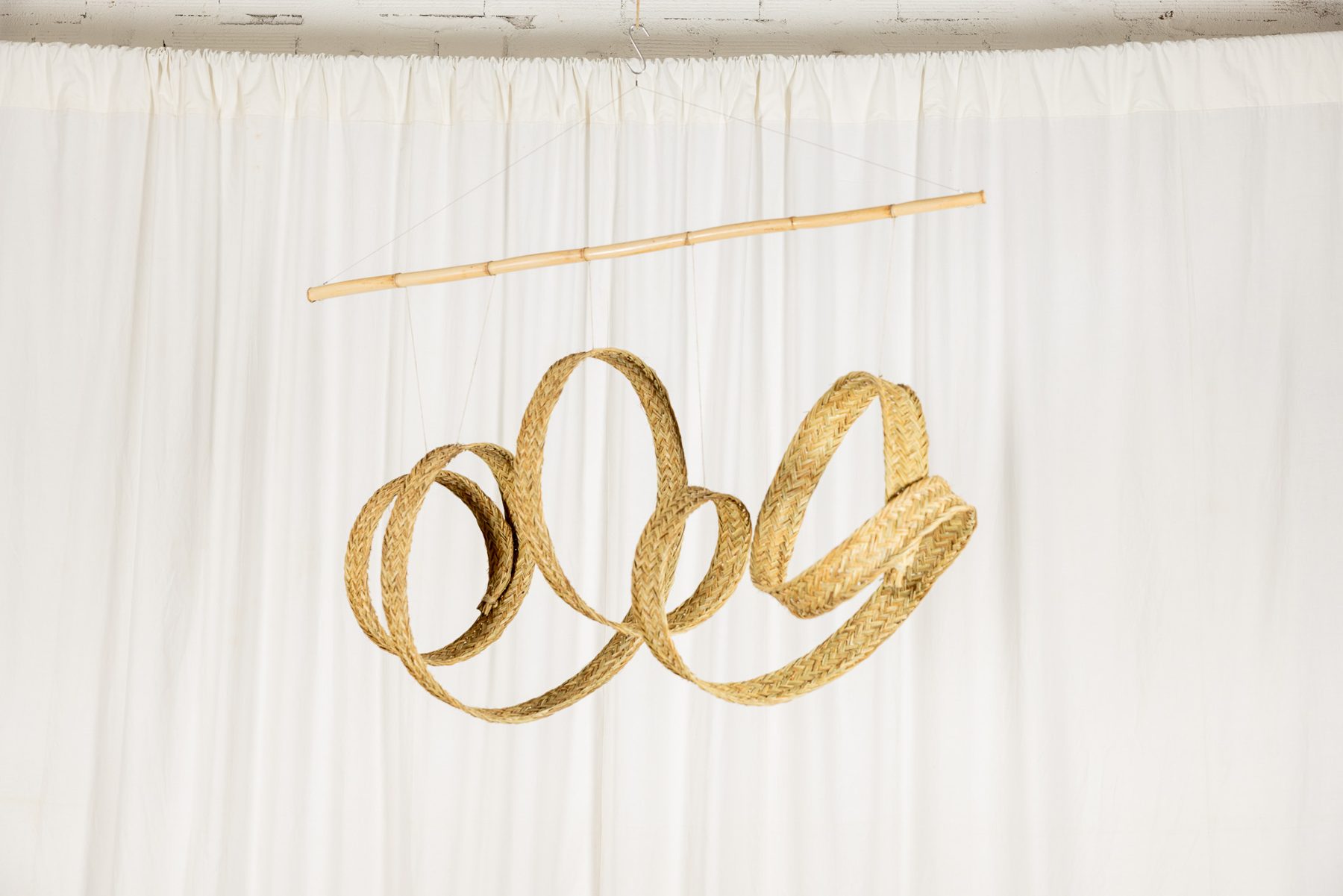 Espart 003, braided esparto sculpture suspended from a cane