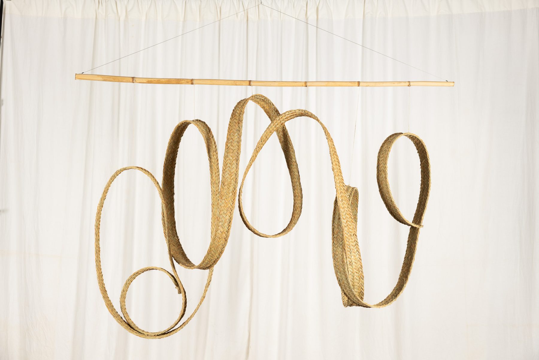 Espart 004, braided esparto sculpture suspended from a cane