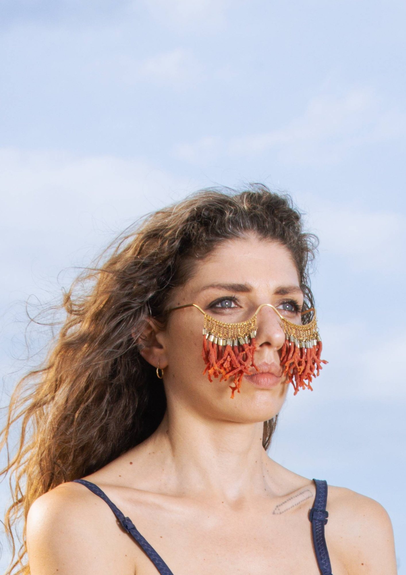 Tears of Coral worn, coral and brass piece by Aloma Lafontana